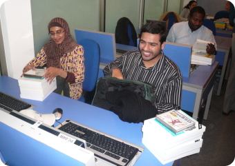 Students enjoying their books at the ccTLD Workshop held in Amman, Jordan from November 26-29, 2007